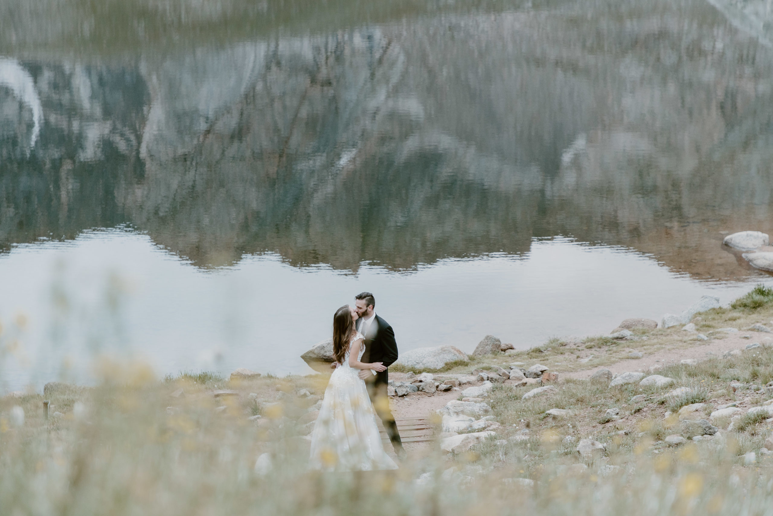 man and woman getting married in the mountains